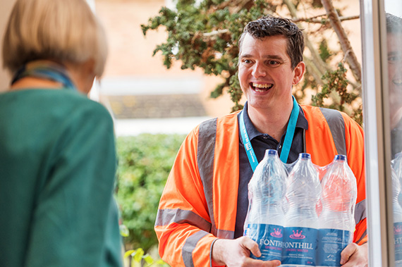 Wessex Water employee delivering bottled water