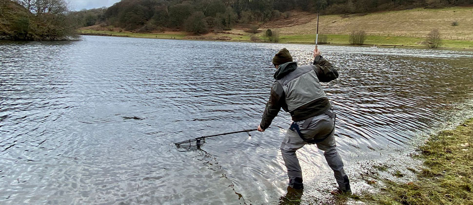 Man with a net at Clatworthy Reservoir