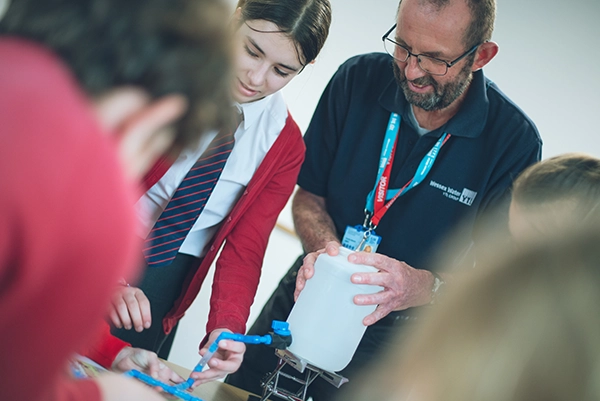 Education Adviser Tim with school children