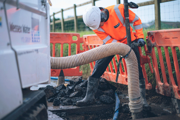 Employee repairing a leak