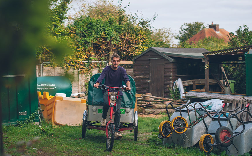 Loop:Frome composting charity worker riding composing bicycle